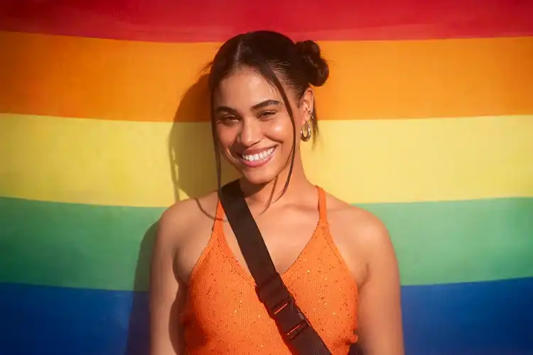 A smiling person in a community setting.