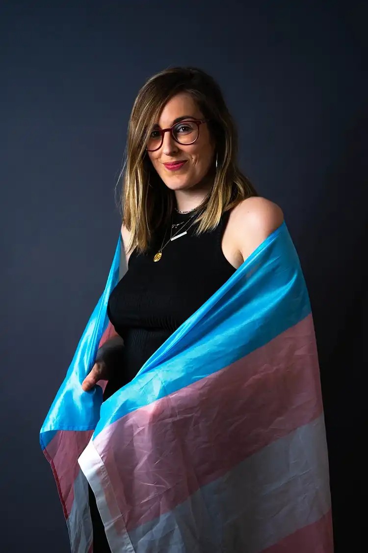 Portrait holding a trans pride flag